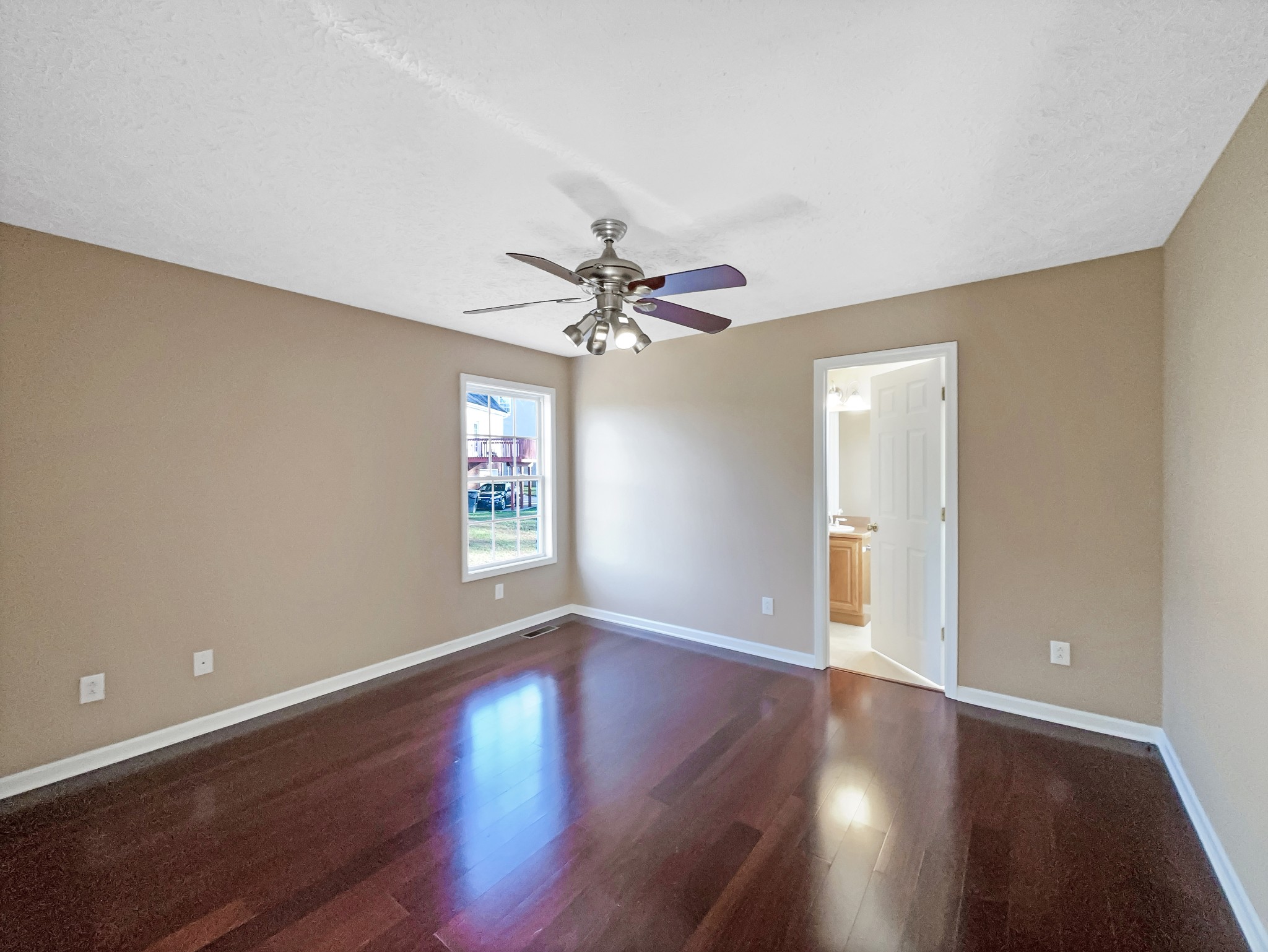 610 Chestnut Court Springfield, TN 37172 - Photo 12 of 17 a view of an empty room with window and wooden floor
