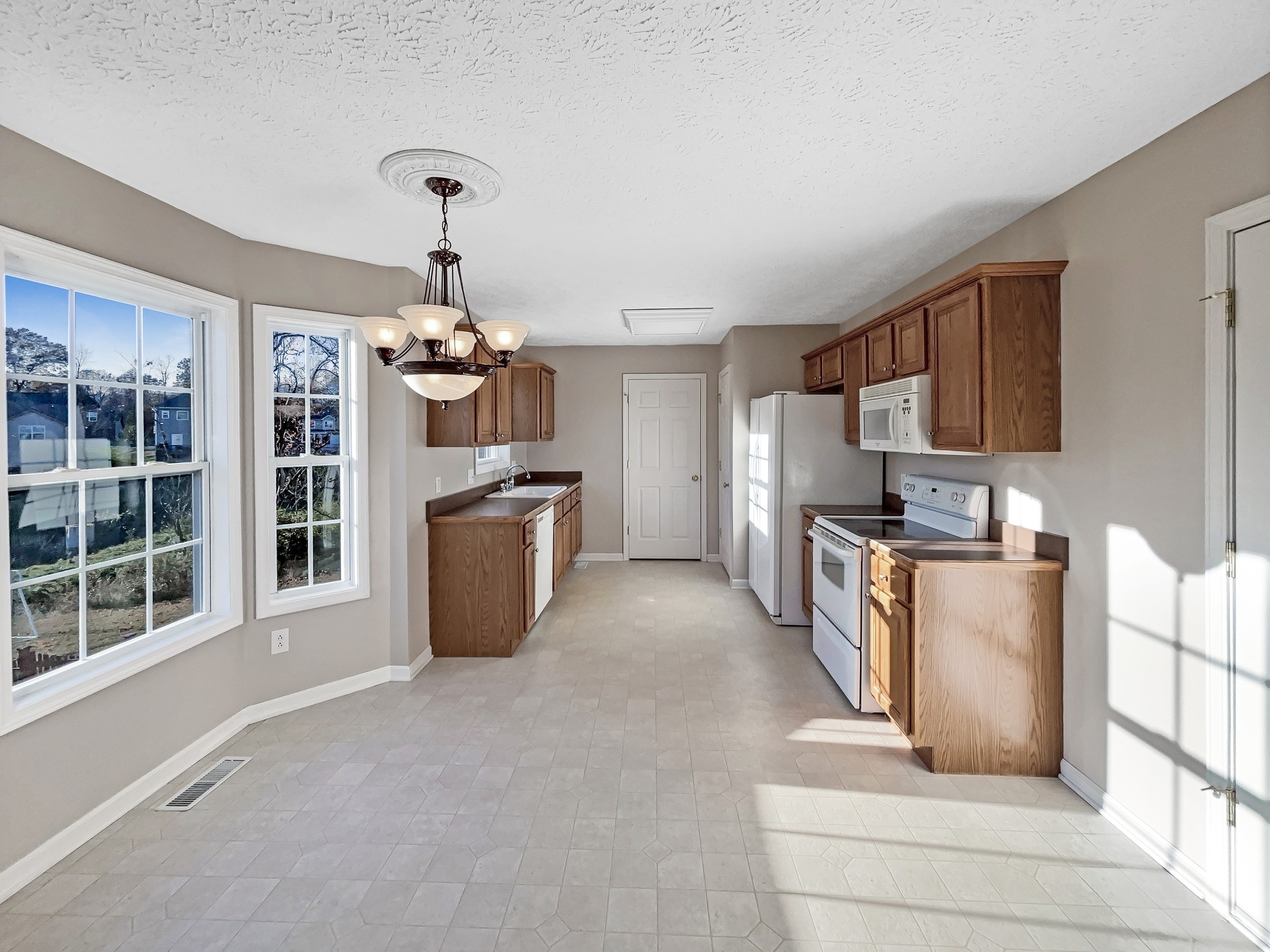 610 Chestnut Court Springfield, TN 37172 - Photo 14 of 17 a kitchen with stainless steel appliances granite countertop a refrigerator and a stove top oven