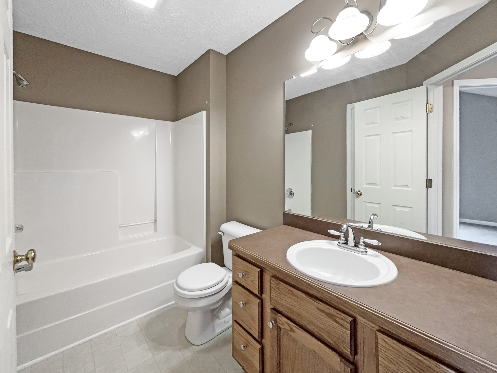 610 Chestnut Court Springfield, TN 37172 - Photo 6 of 17 a bathroom with a granite countertop sink toilet and shower