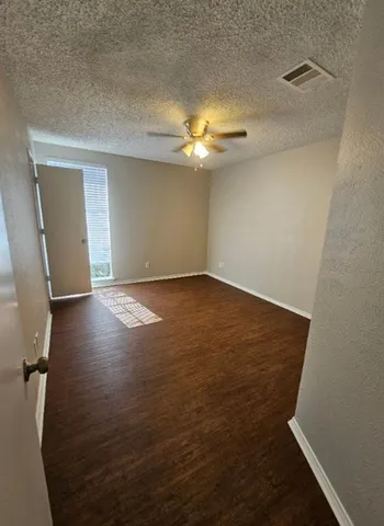 a bathroom with a sink a toilet a mirror and bathtub