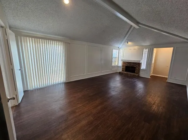 a kitchen with stainless steel appliances a refrigerator a stove and cabinets