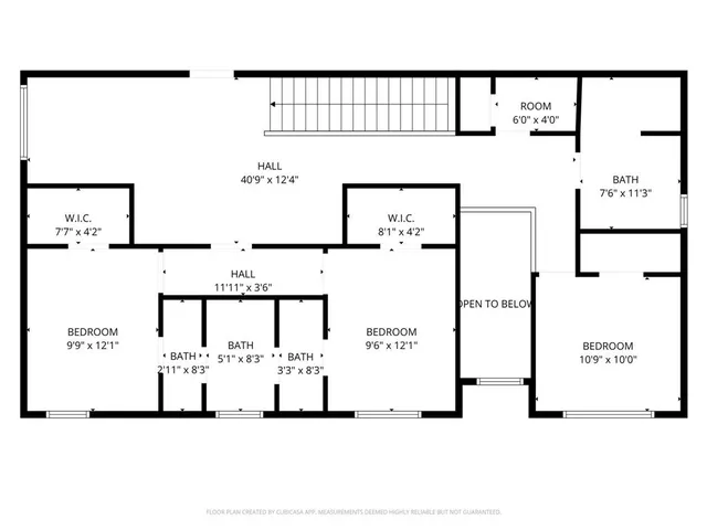 a black and white photo of a small living room