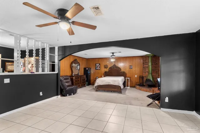 a bedroom with a bed and window