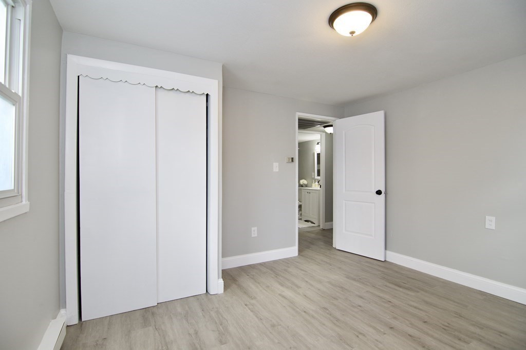 160 Laurelton Street Springfield, MA 01109 - Photo 23 of 30 an empty room with wooden floor and closet area