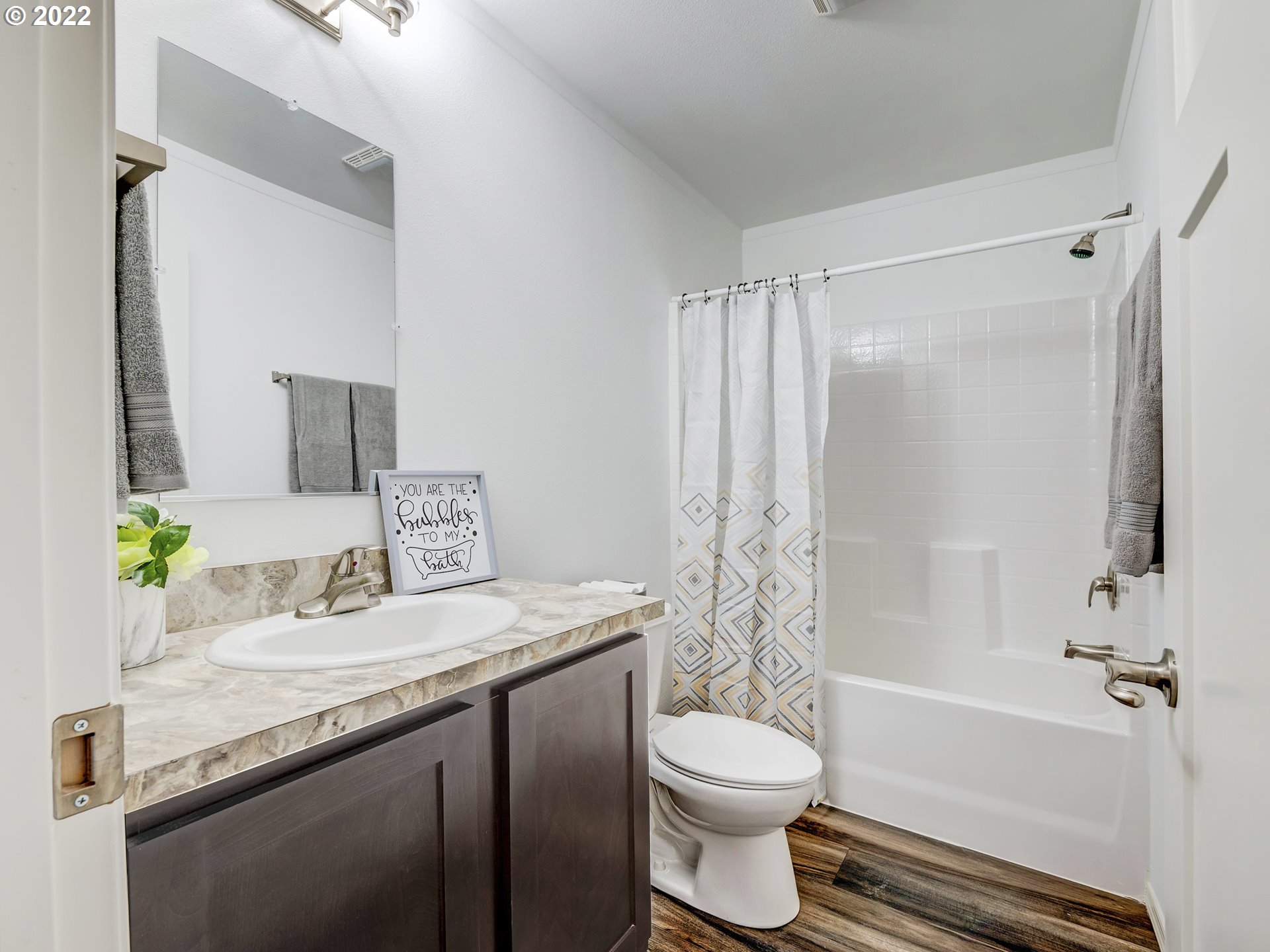 4671 Union Terrace Springfield, OR 97478 - Photo 11 of 18 a bathroom with a granite countertop sink toilet and shower