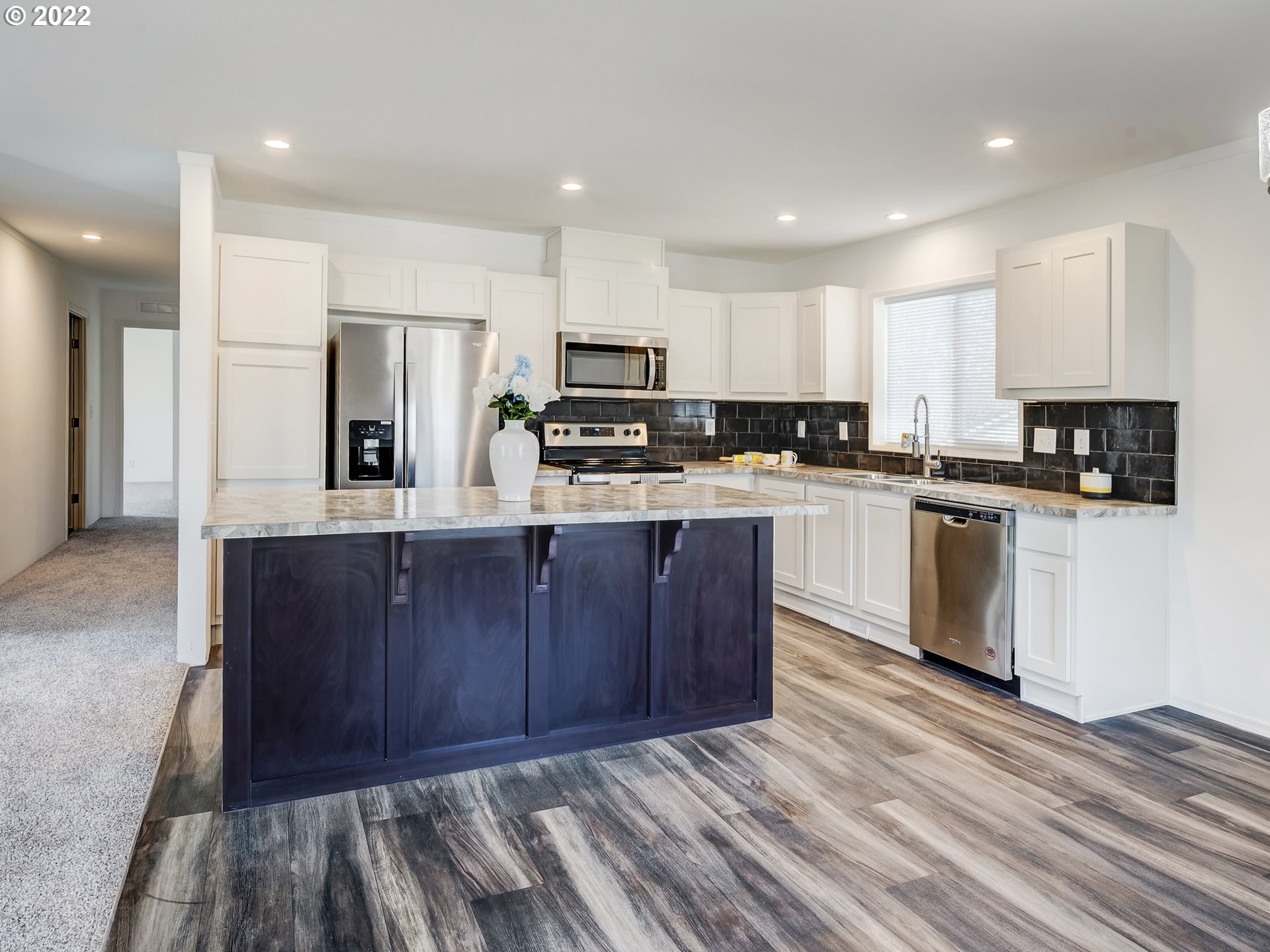 4671 Union Terrace Springfield, OR 97478 - Photo 5 of 18 a kitchen with stainless steel appliances granite countertop wooden cabinets a refrigerator a stove a sink and a oven