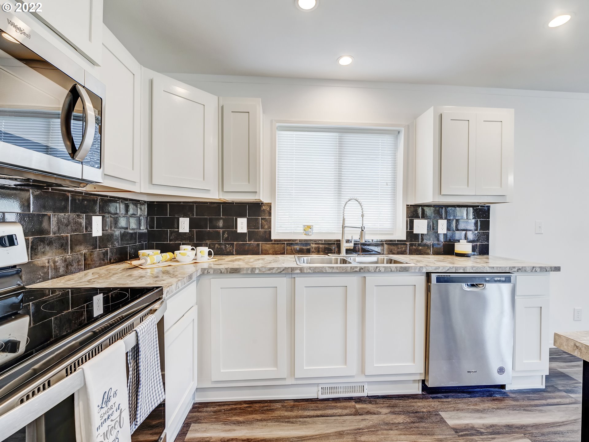 4671 Union Terrace Springfield, OR 97478 - Photo 7 of 18 a kitchen with stainless steel appliances granite countertop a sink stove and cabinets