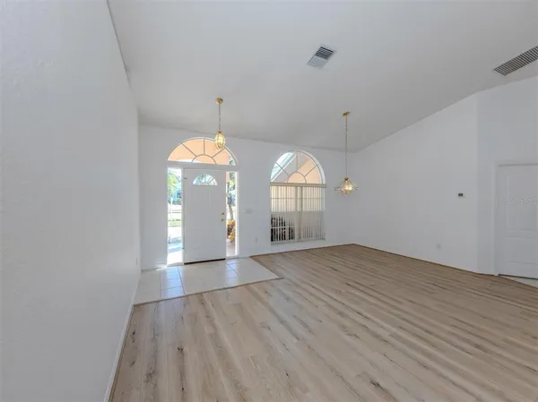 a view of an empty room with a window