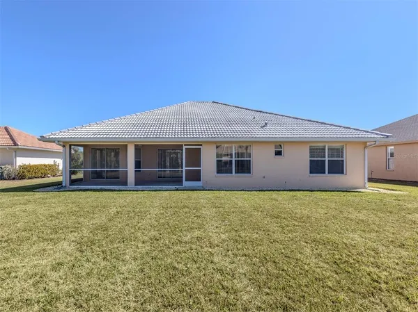 a front view of house with yard and outdoor seating