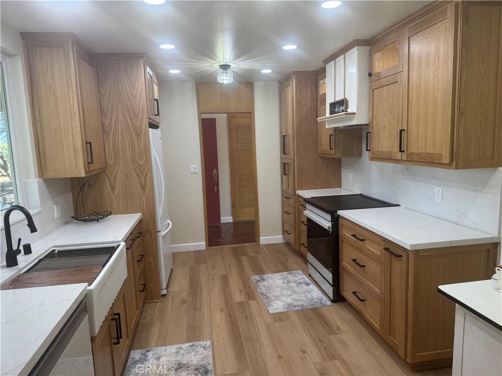 4501 Nielson Phelan, CA 92371 - Photo 15 of 33 a kitchen with a sink stove and refrigerator