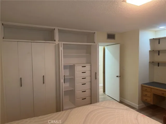 a room with a bed and a table in it