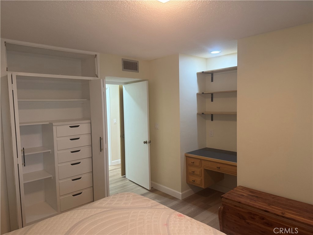 4501 Nielson Phelan, CA 92371 - Photo 22 of 33 a bedroom with a bed and a dresser