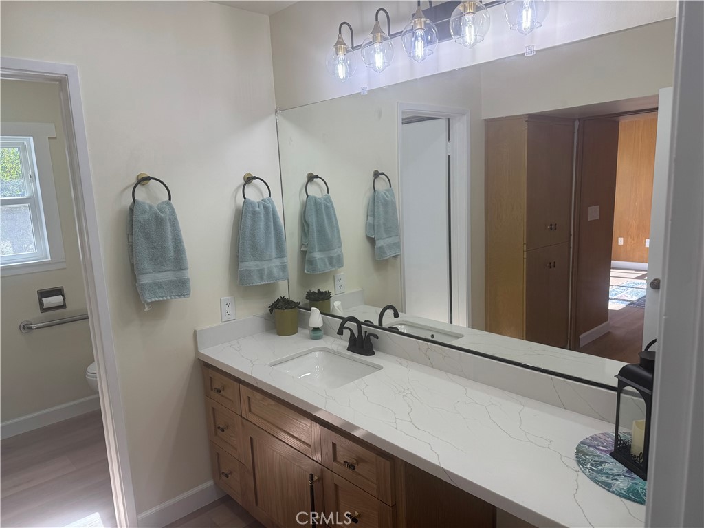 4501 Nielson Phelan, CA 92371 - Photo 25 of 33 a bathroom with a double vanity sink a vanity and a mirror