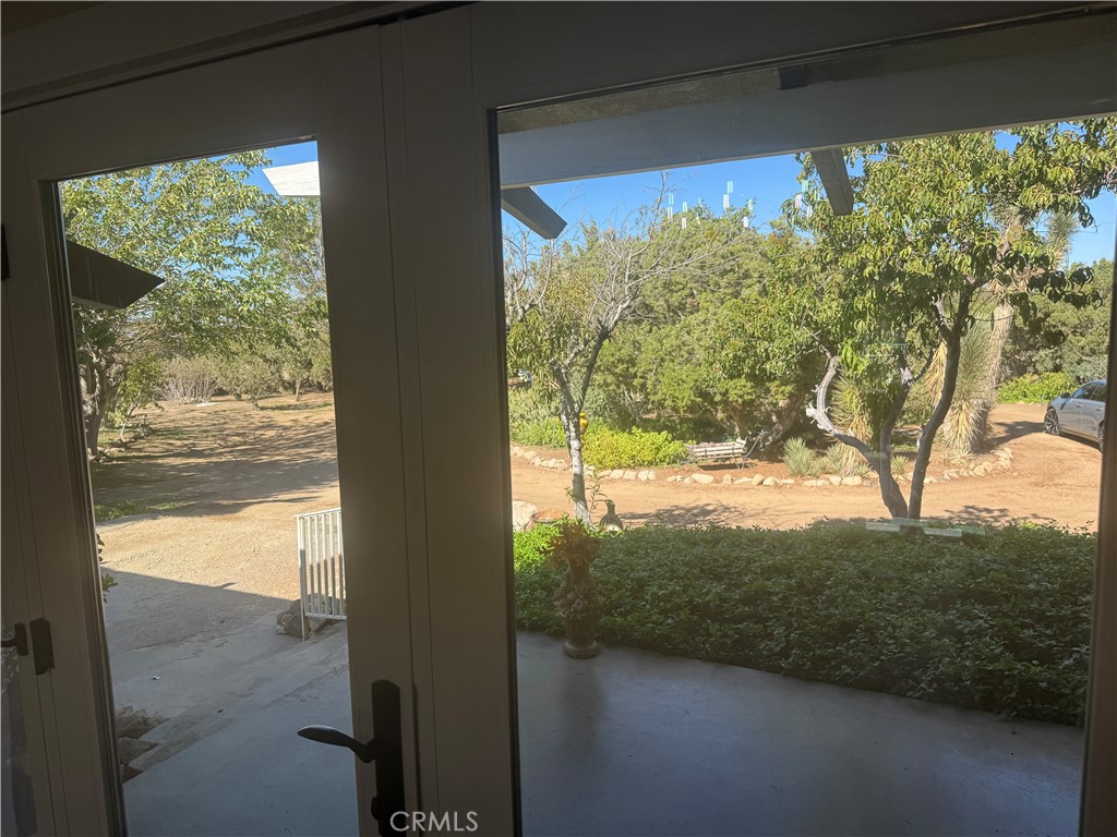 4501 Nielson Phelan, CA 92371 - Photo 7 of 33 a view of a glass door and a yard