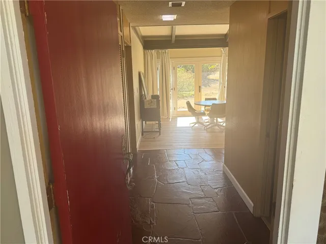 a living room with furniture a large window and a fireplace