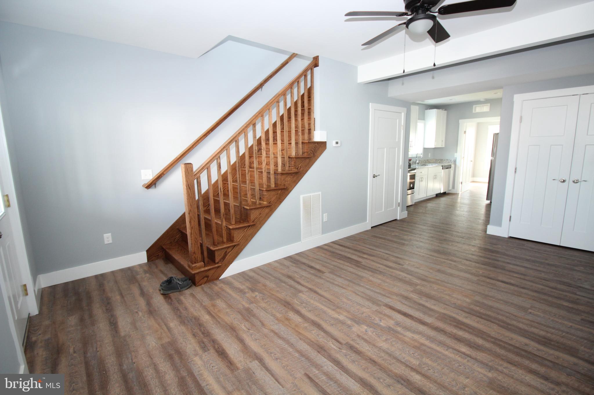 a view of an entryway with wooden floor
