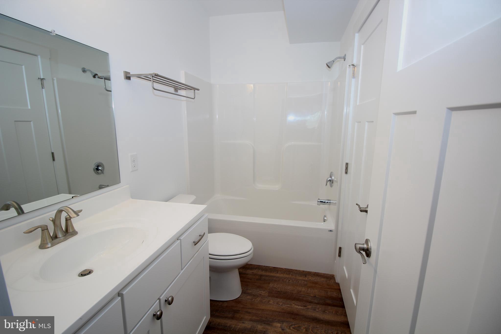 306 Main Street Dover, DE 19901 - Photo 13 of 33 a bathroom with a sink toilet and shower
