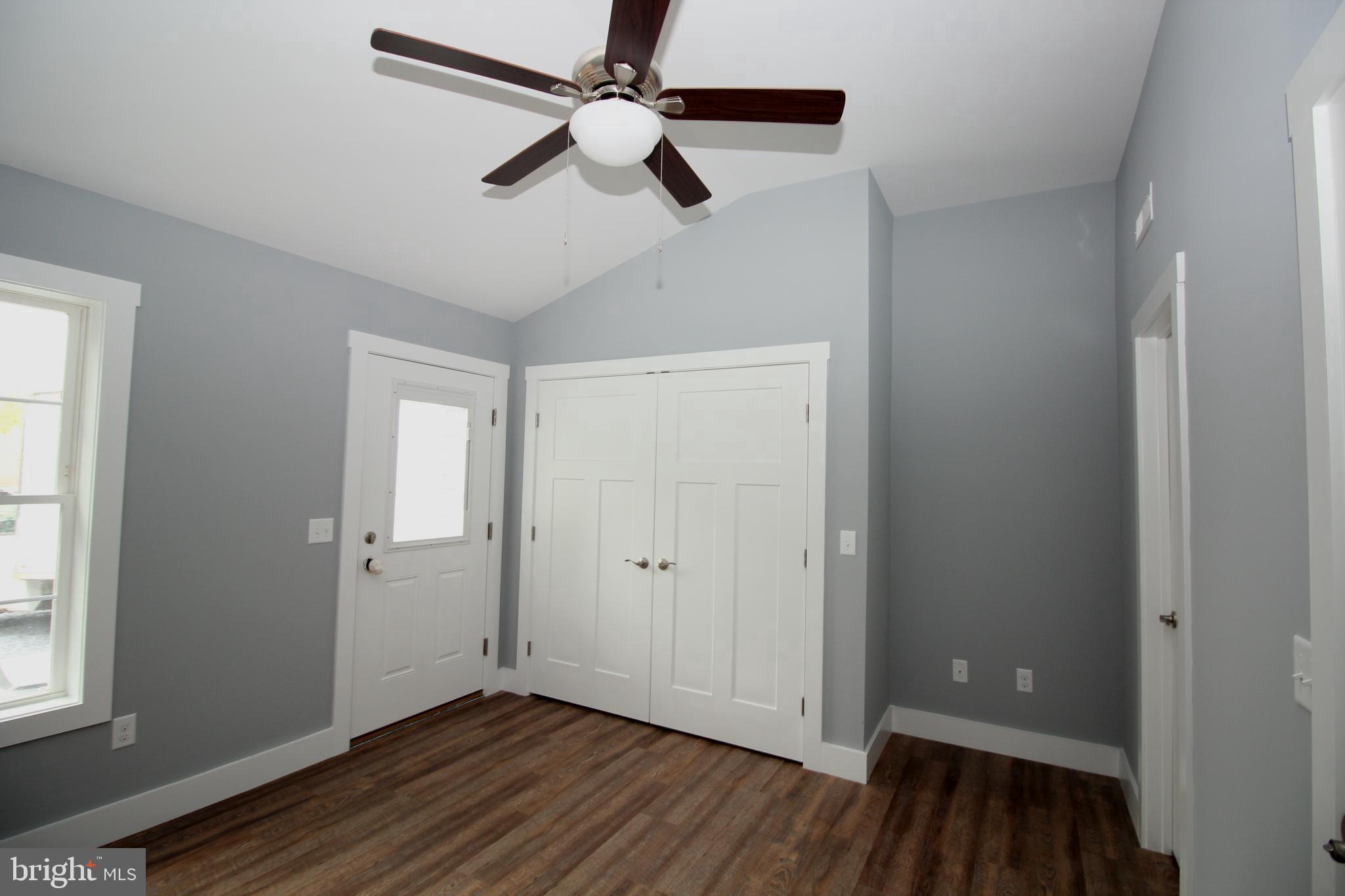 306 Main Street Dover, DE 19901 - Photo 19 of 33 wooden floor in an empty room with a window