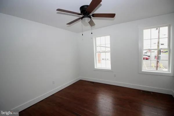 a room with window and wooden floor