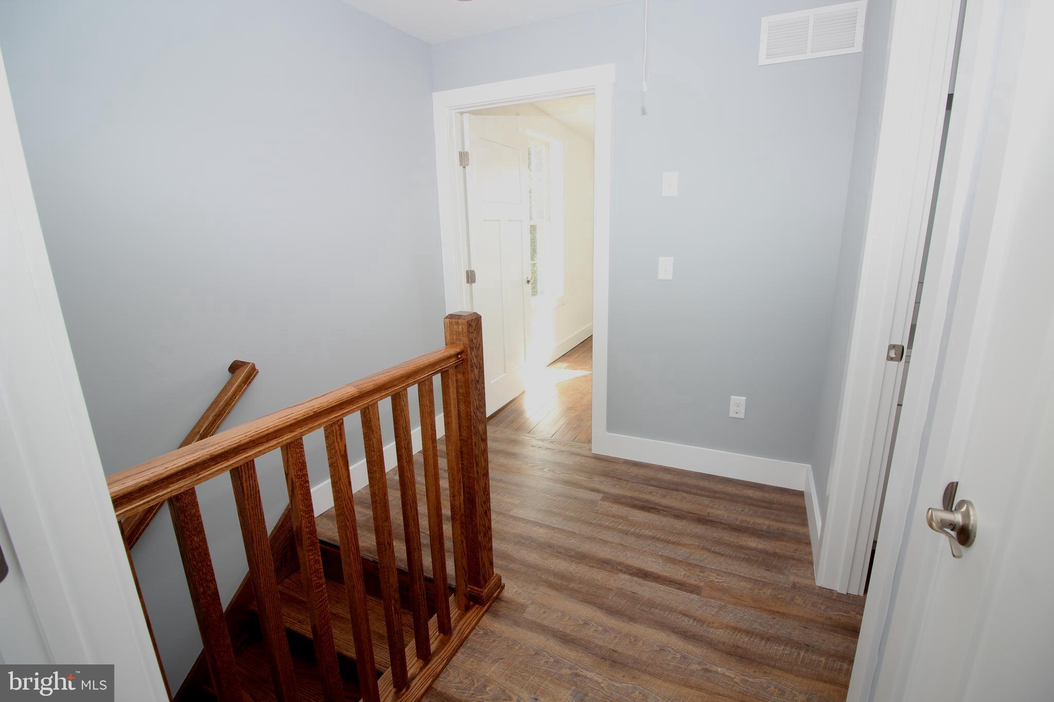 306 Main Street Dover, DE 19901 - Photo 30 of 33 a view of a hallway with wooden floor