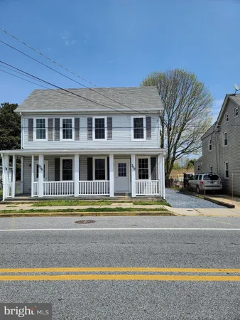 a front view of a house with a swimming pool