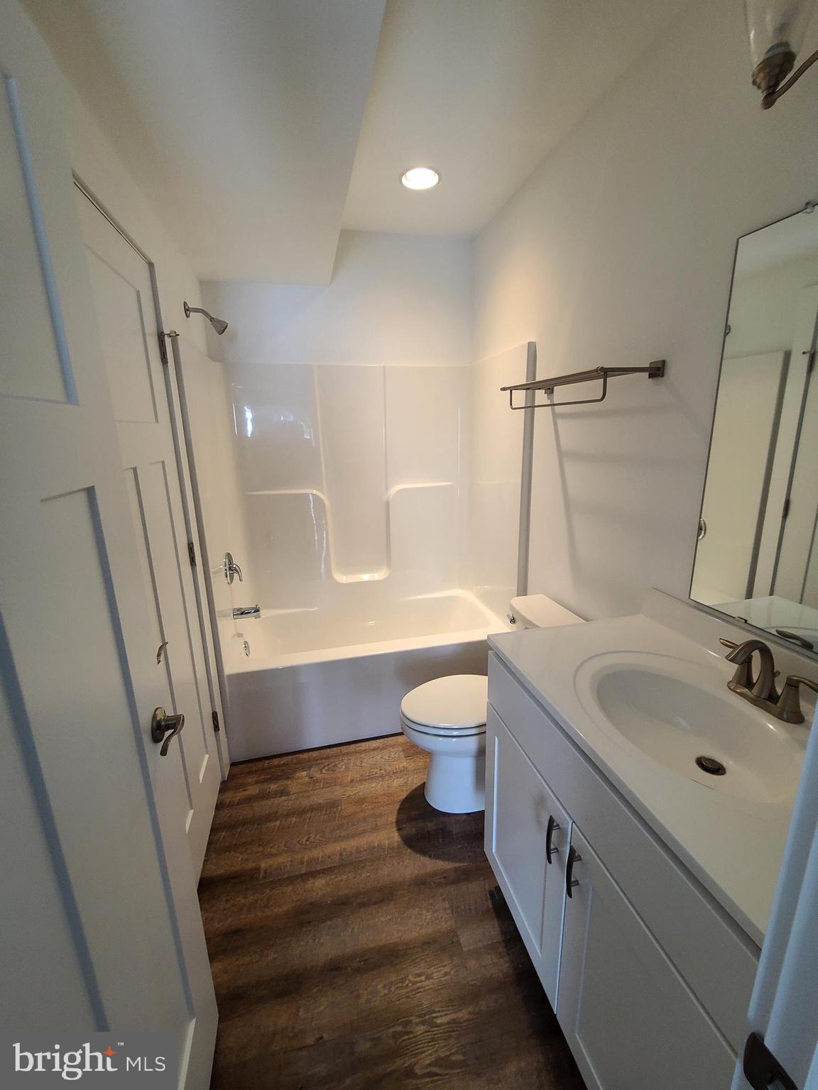 306 Main Street Dover, DE 19901 - Photo 8 of 33 a bathroom with a sink a toilet and shower