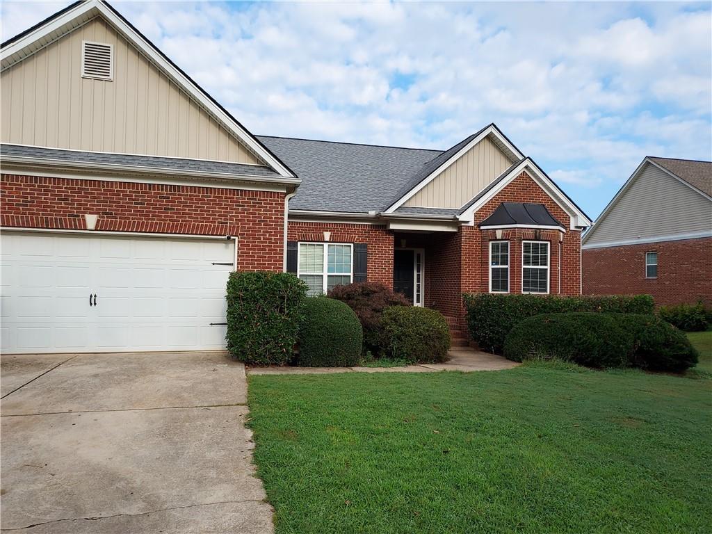 5490 Noah Road Cumming, GA 30041 - Photo 1 of 1 a front view of a house with a yard