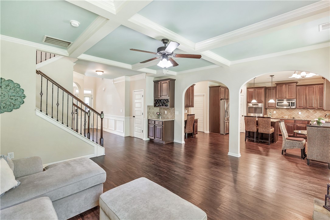 144 Buckland Drive Anderson, SC 29621 - Photo 40 of 48 Rich hardwood floors unite an open-concept living space with a gourmet kitchen and a custom wet bar.