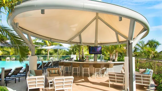 a room with lots of chairs and mirrors