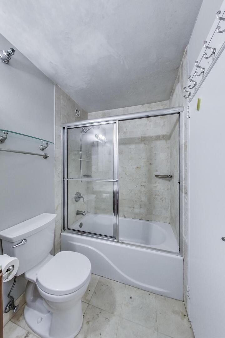 70 West Huron Street, Unit 1103 Chicago, IL 60654 - Photo 14 of 18 a bathroom with a shower and a toilet