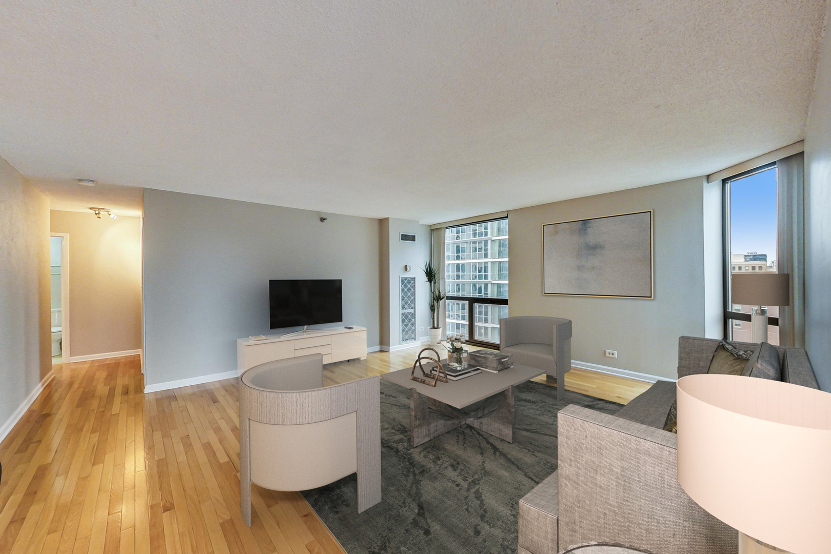 70 West Huron Street, Unit 1103 Chicago, IL 60654 - Photo 4 of 18 a living room with furniture and a flat screen tv