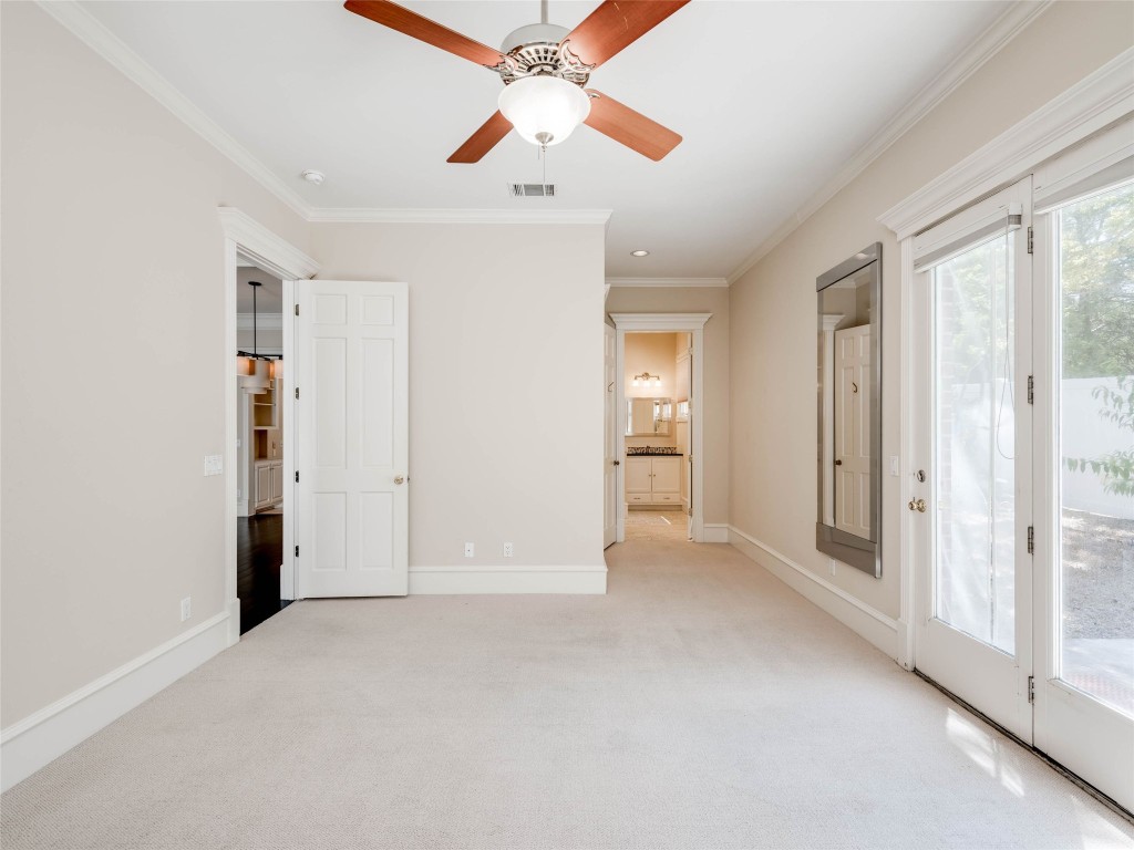 4010 Long Champ Drive, Unit 23 Austin, TX 78746 - Photo 16 of 38 an empty room with closet and a ceiling fan