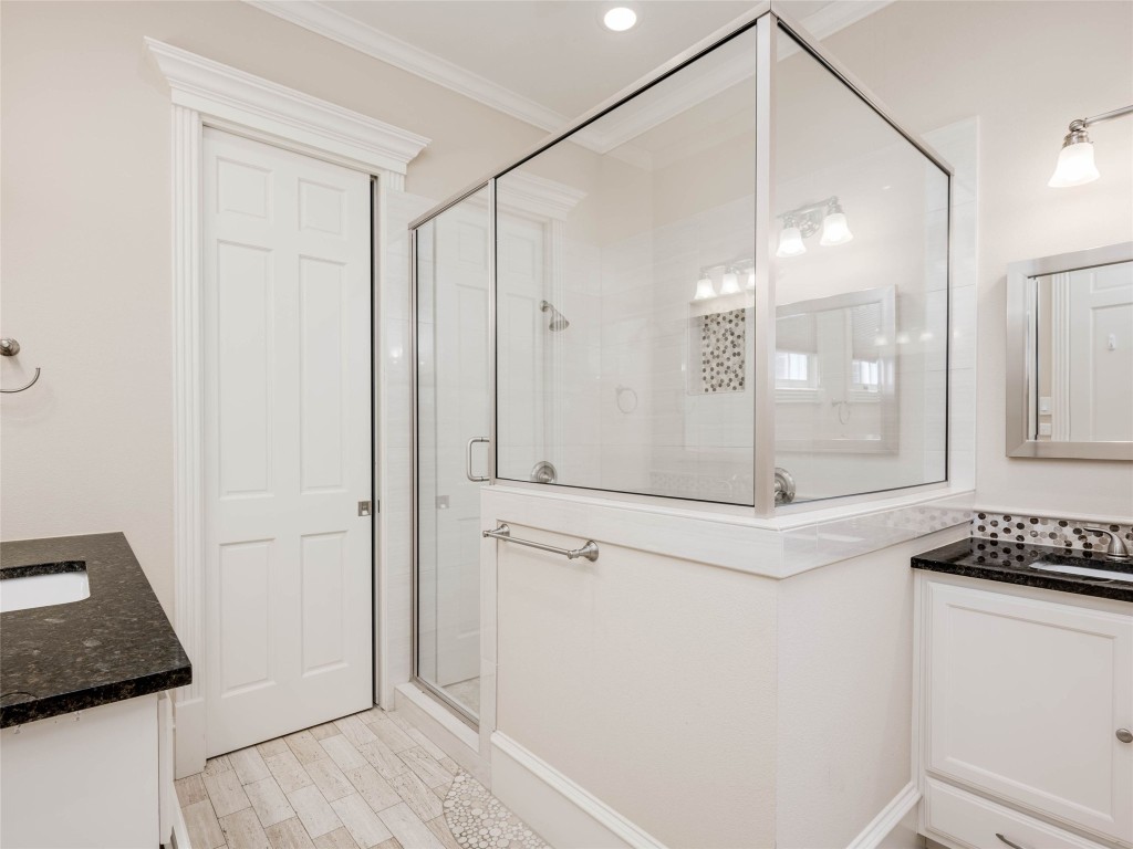 4010 Long Champ Drive, Unit 23 Austin, TX 78746 - Photo 19 of 38 a bathroom with a shower and a mirror
