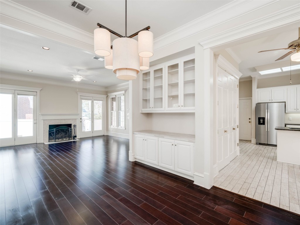 4010 Long Champ Drive, Unit 23 Austin, TX 78746 - Photo 3 of 38 a view of empty room with wooden floor and fireplace