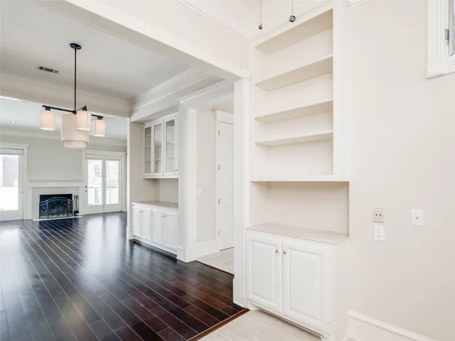 a view of a room with wooden floors and fireplace