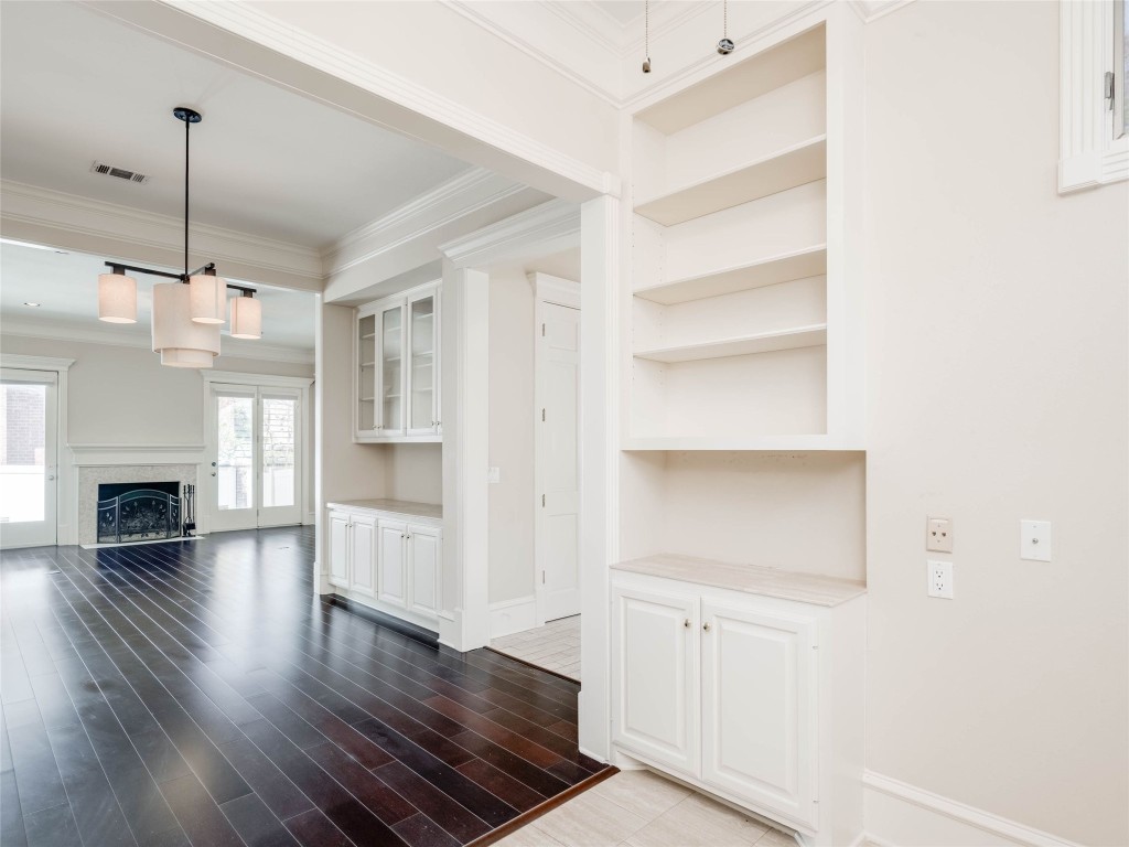 4010 Long Champ Drive, Unit 23 Austin, TX 78746 - Photo 6 of 38 a view of a room with wooden floors and fireplace