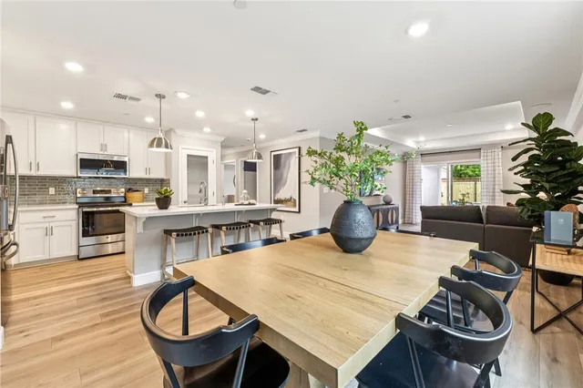 a kitchen with a table and chairs in it