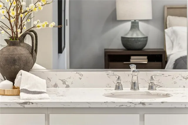 a view of living room with furniture and lamp