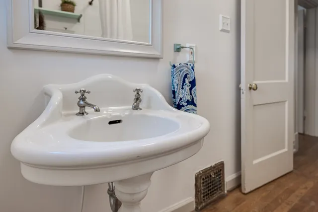 a bathroom with a sink and a mirror