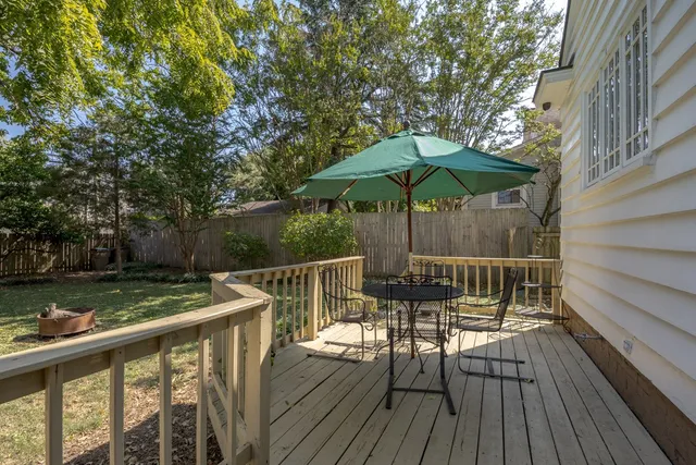 a view of deck with furniture and barbeque oven
