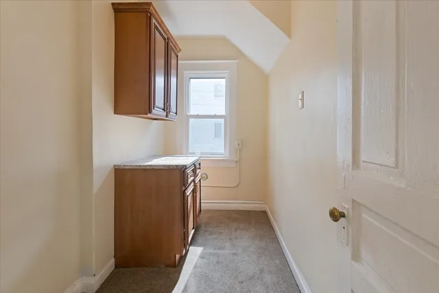 a utility room with a sink dryer and washer