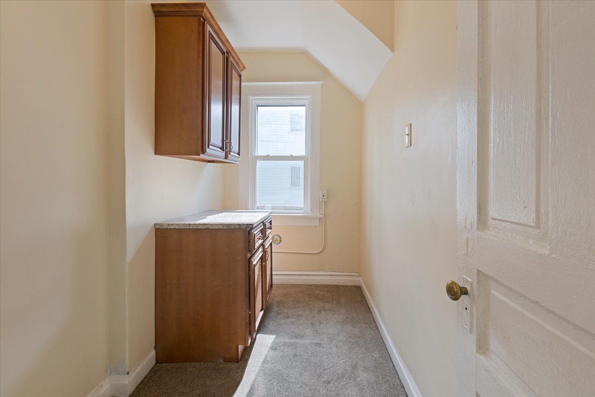 710 South Martin Luther King Junior Avenue Waukegan, IL 60085 - Photo 18 of 35 a utility room with a sink dryer and washer