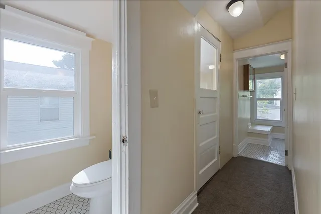a bathroom with a toilet sink and shower