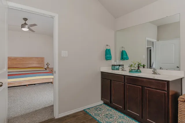 a bedroom with a bed and a dresser