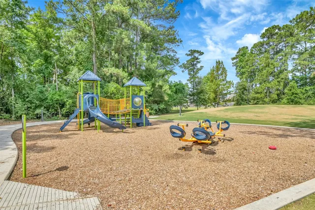 a view of a swimming pool and lounge chair