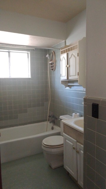 5945 Mill Branch Road Columbus, GA 31907 - Photo 4 of 7 a bathroom with a toilet a sink and mirror