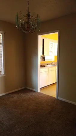 a view of an empty room and window