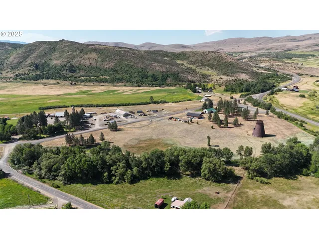 a view of a swimming pool with a yard