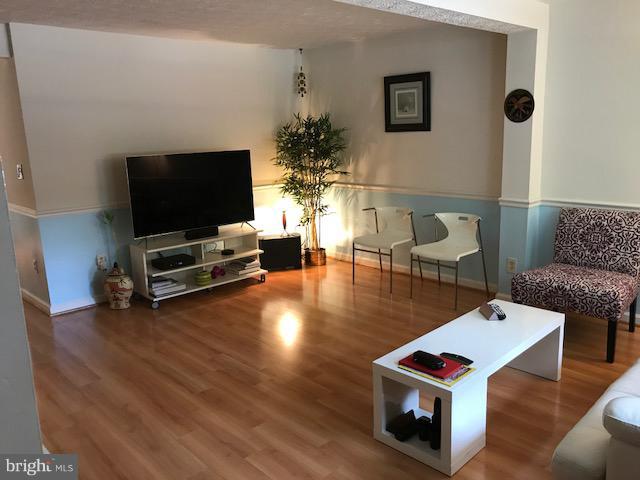 1644 Barnstead Drive Reston, VA 20194 - Photo 2 of 23 a living room with furniture and a flat screen tv