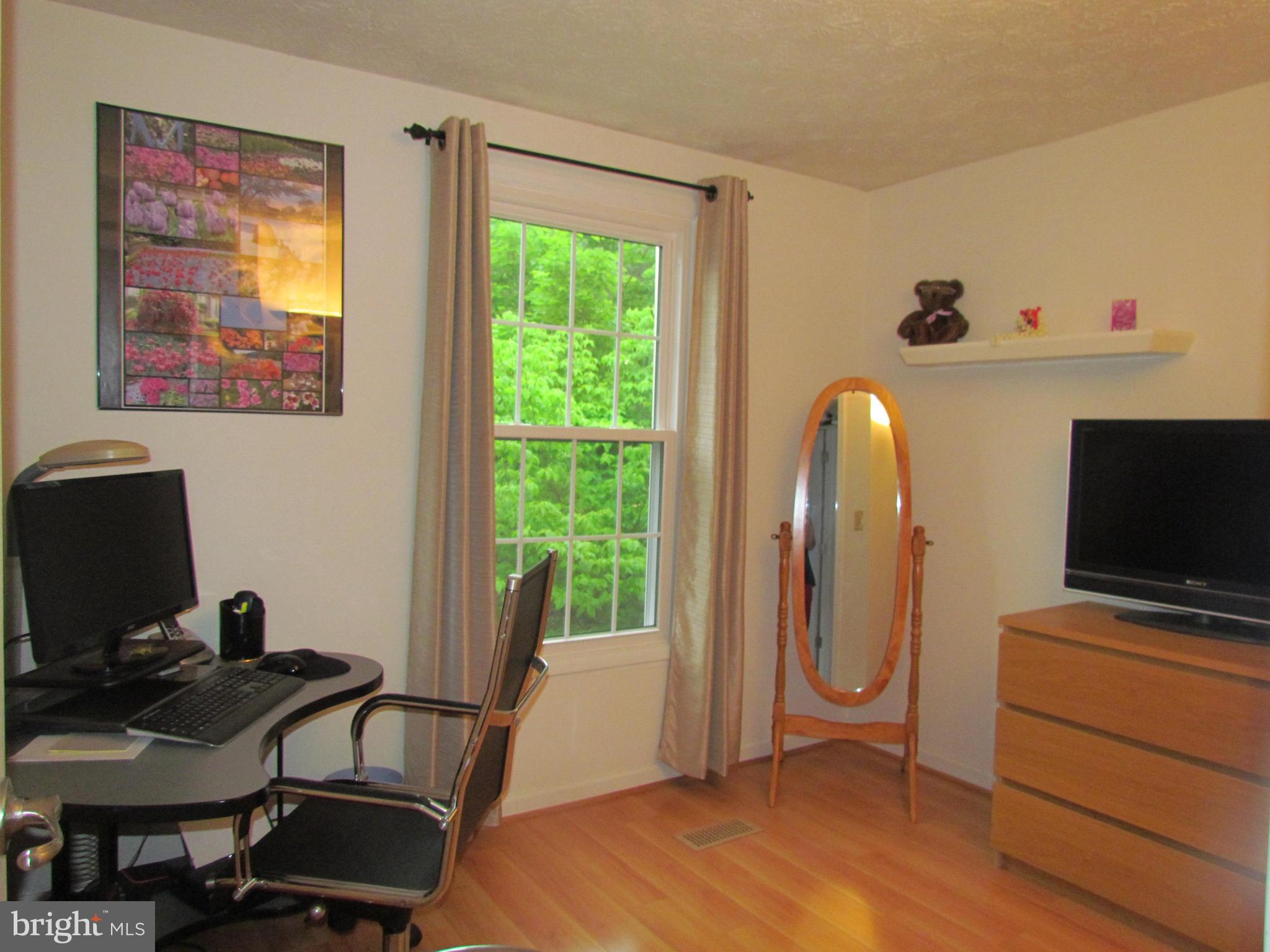 1644 Barnstead Drive Reston, VA 20194 - Photo 18 of 23 a view of a workspace with furniture and a window